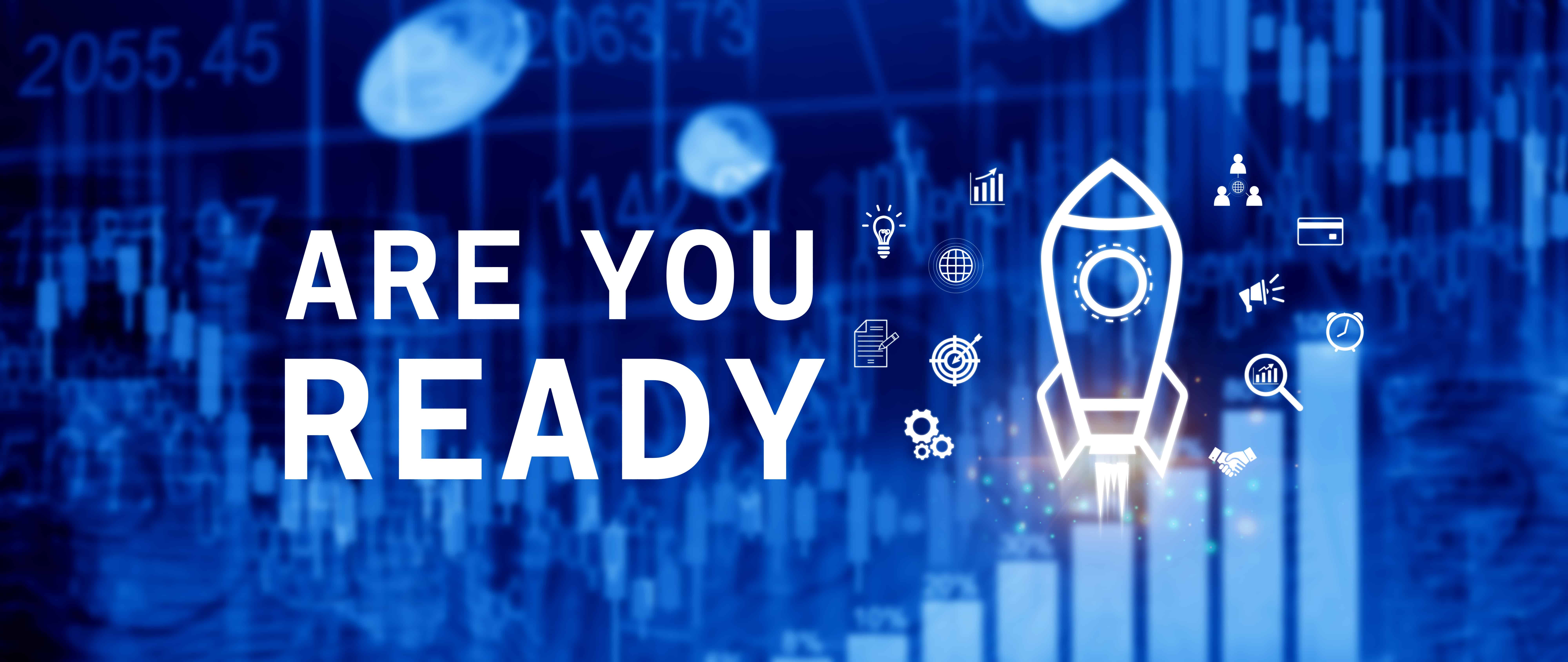 Text ARE YOU READY next to a rocket icon surrounded by business and technology symbols, set against a blue background with financial charts and numbers.